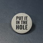 "Put It In The Hole" grey leather ball marker